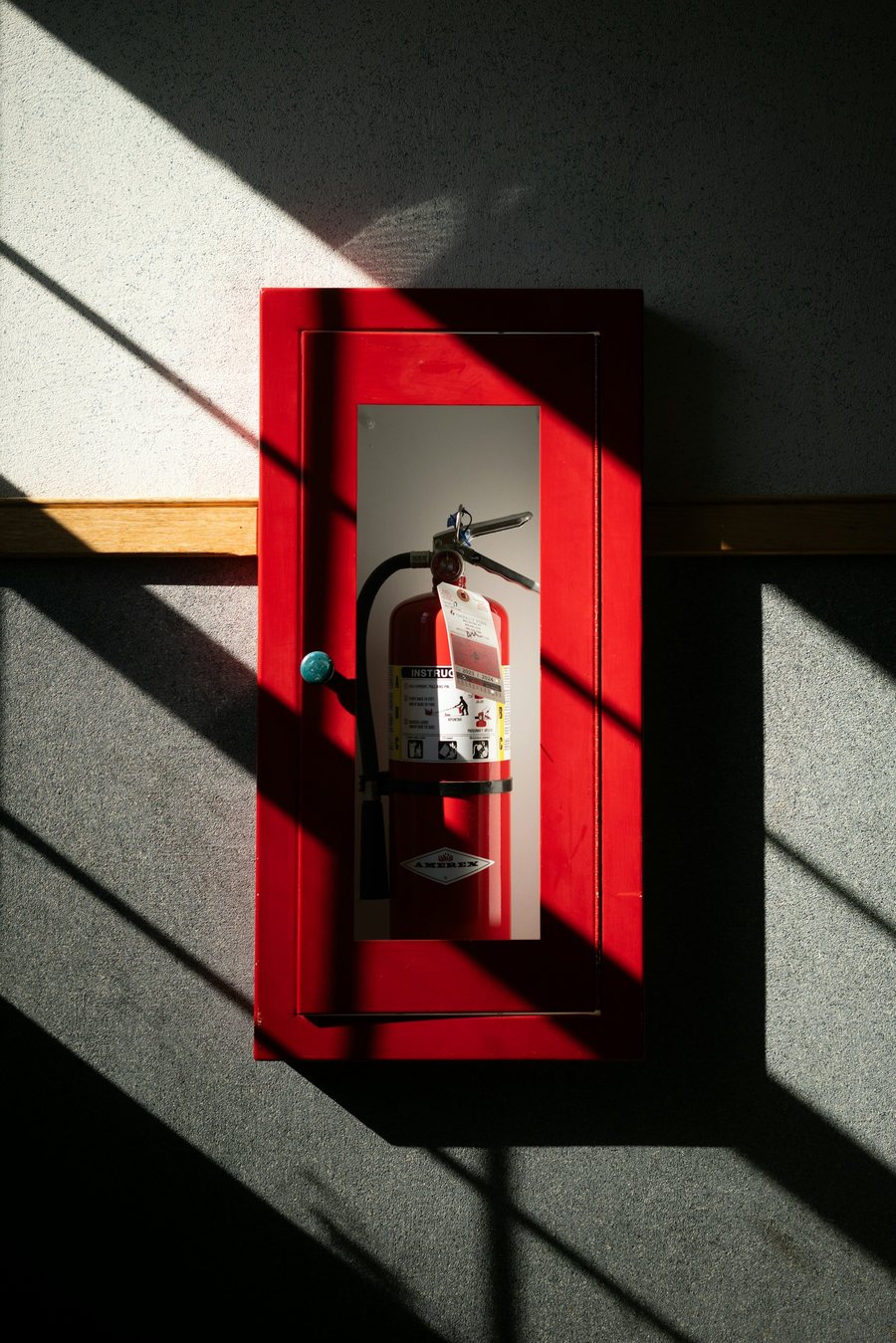 Fire extinguisher cabinet mounted on a wall