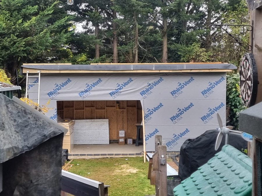 Outbuilding under construction with breathable membrane